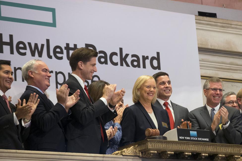 Meg Whitman, (C) Chief Executive Officer of Hewlett-Packard, and company executives ring the opening bell at the New York Stock Exchange to celebrate the start of trading of Hewlett Packard Enterprise Co.